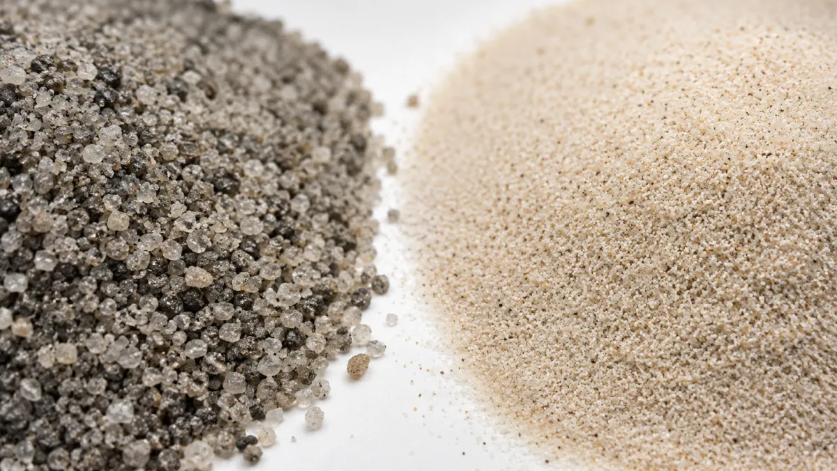 Coarse concrete bedding sand next to fine play sand to show the difference in grain