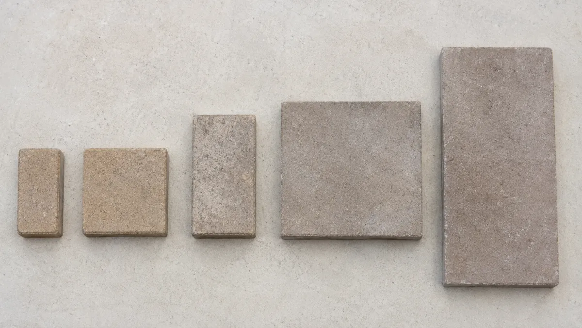 Several common paver sizes shown side by side, from small brick pavers to large square pavers